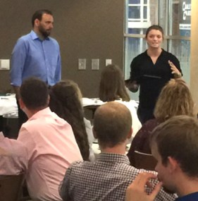 CIB Intelligence Essay Award winner Sarah Harvey describes her research to banquet participants